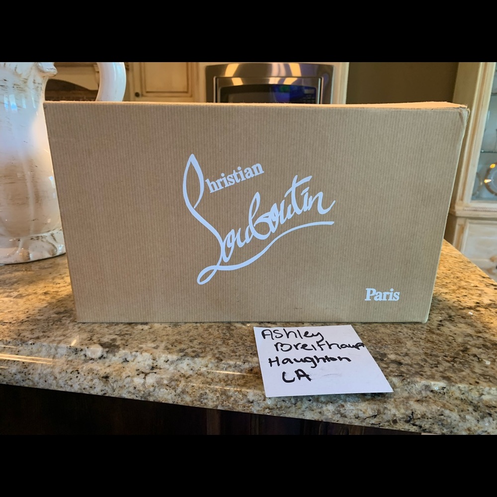 Christian Louboutin Patent Leopard Print heels.